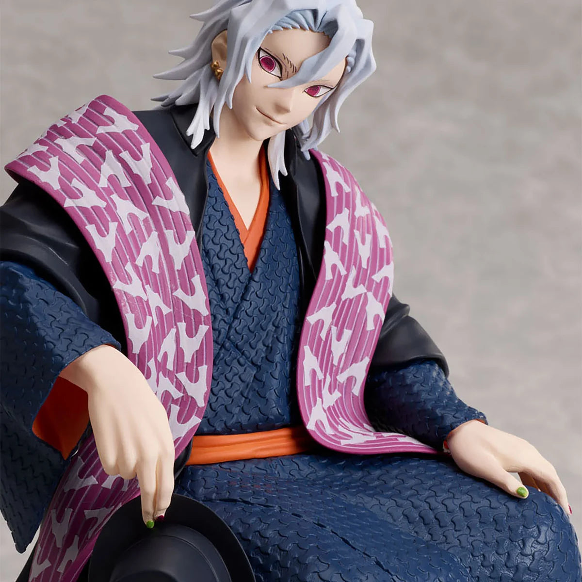 Close-up of Tengen Uzui Aniplex figure showing white hair, eyes and facial details
